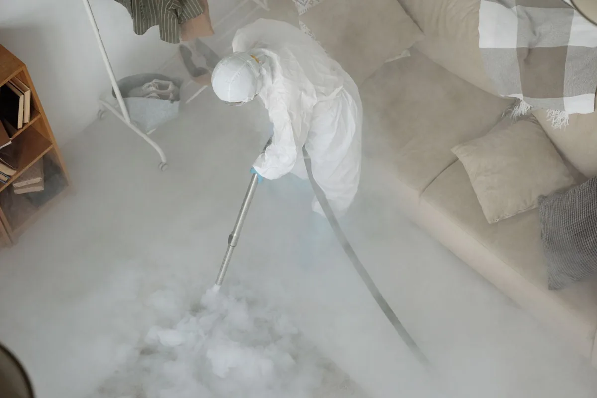 Biohazard cleanup technician in protective equipment, Darien, WI